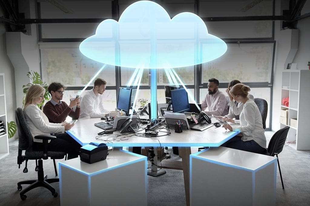 An office group of workers using various devices and streaming from the cloud.