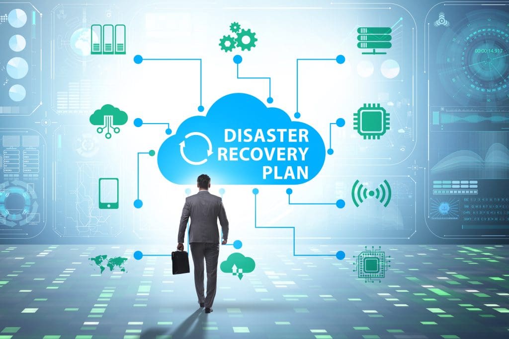 A business man walking toward a graphic representation of a disaster recovery plan.