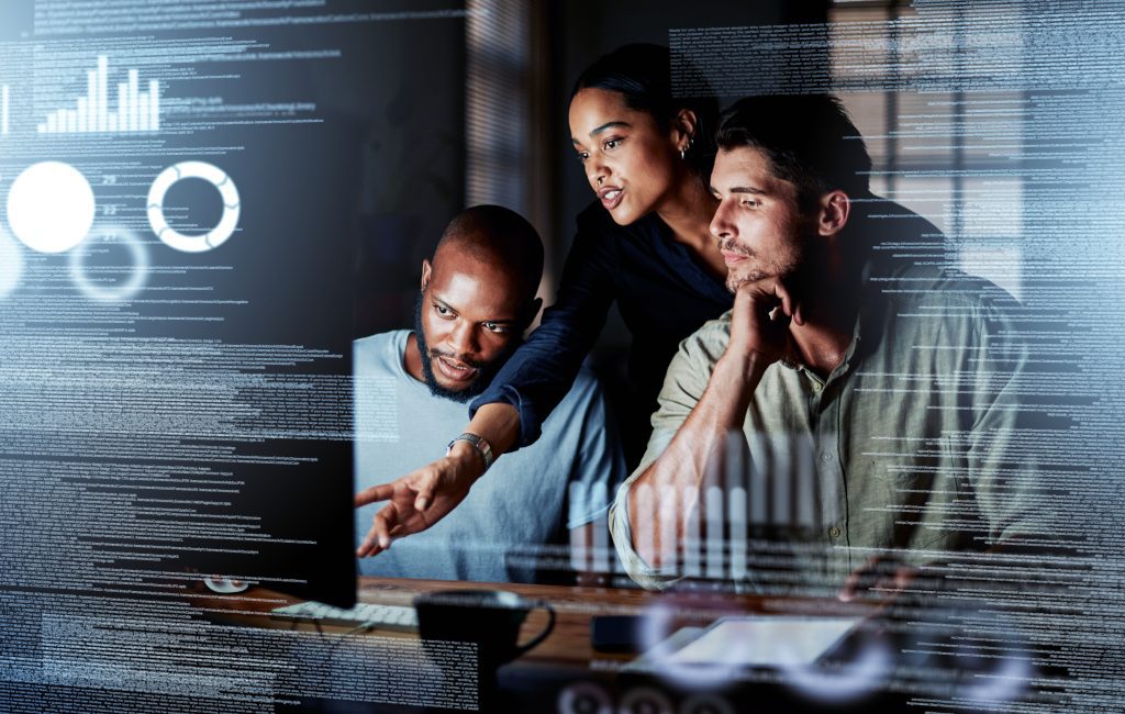 A group of programmers writing code on a computer.