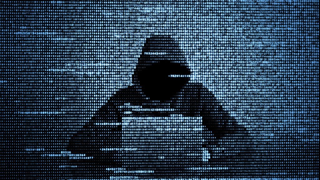 A hacker in a hoodie at a laptop, represented in digital numbers of varying fullness.