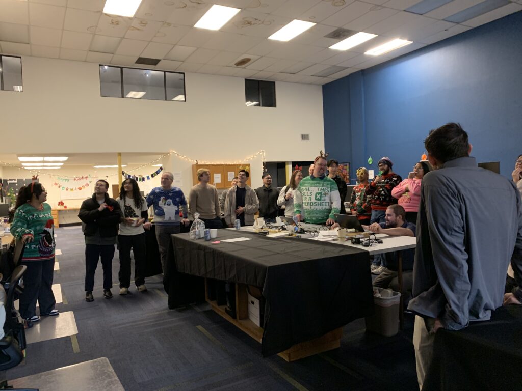 The PC Professional team dressed up in holiday attire, playing a game of Jeopardy